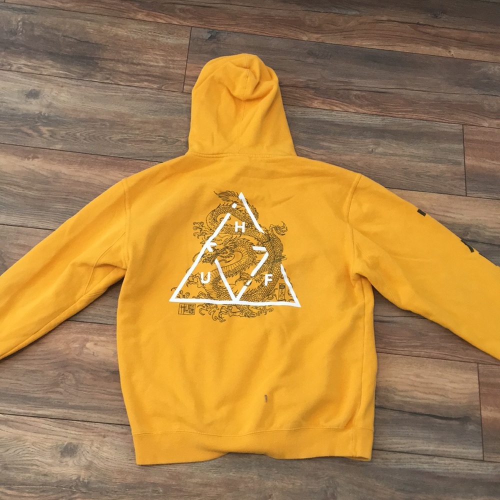 Yellow sweatshirt with foreign writing